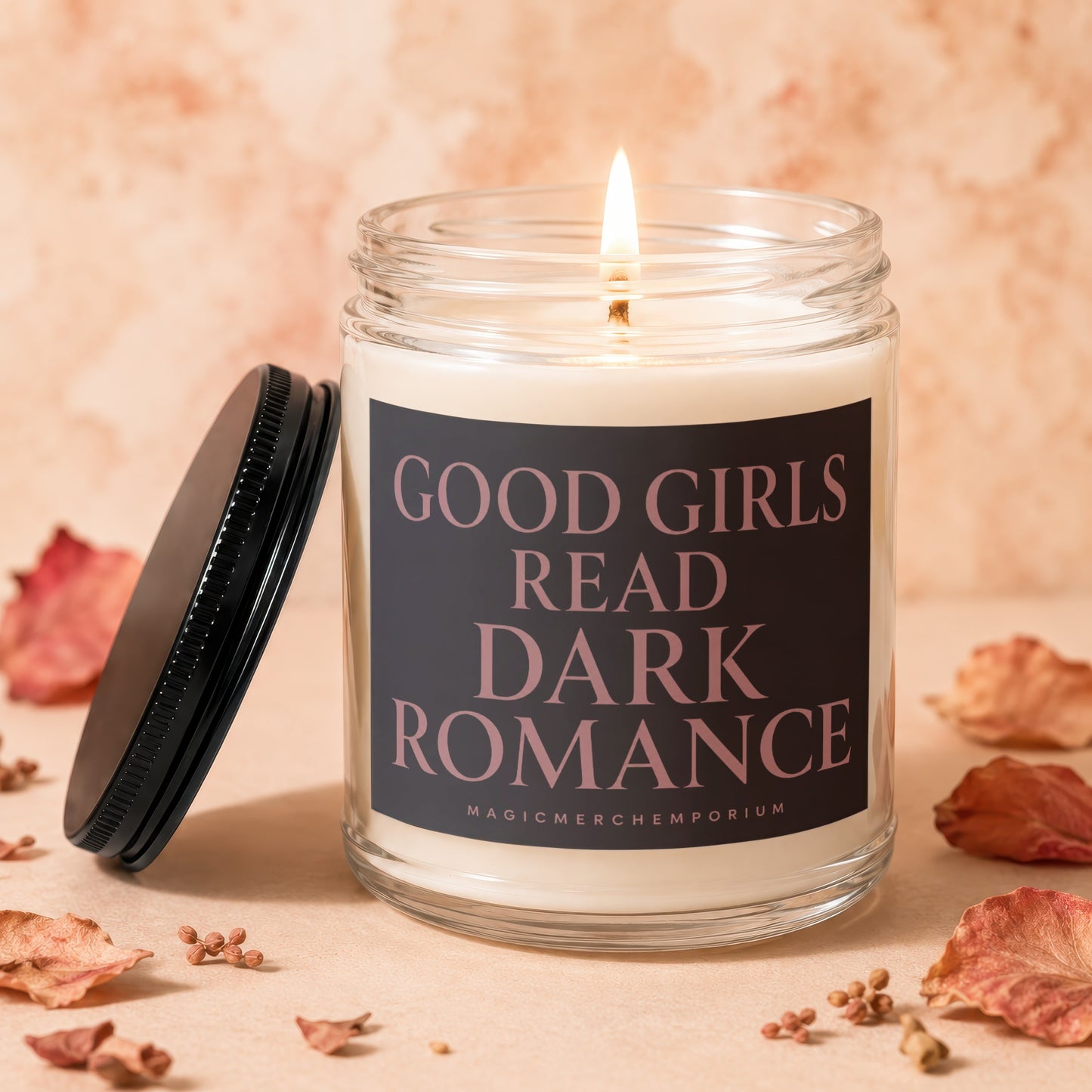 Candle with lit flame, labeled "Good Girls Read Dark Romance".