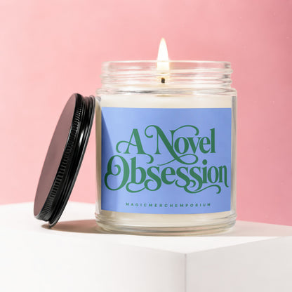 Candle with blue label reading "A Novel Obsession" and "MAGICMERCHEMPORIUM".