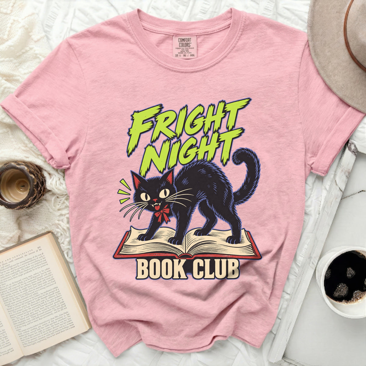 Pink t-shirt with black cat on open book, text "Fright Night Book Club".