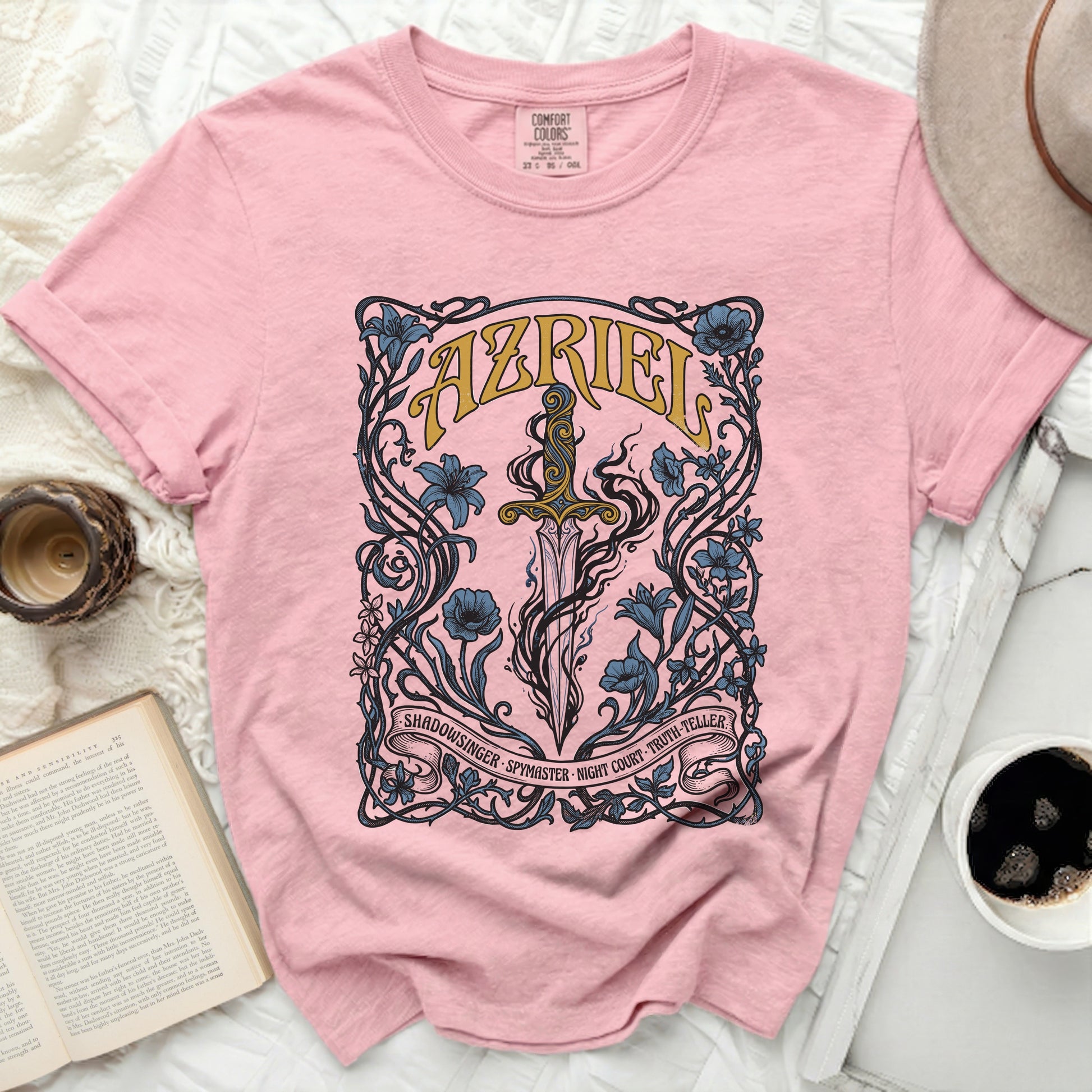 Pink t-shirt with a sword and floral design, featuring "Azriel" and "Shadowsinger Spymaster Night Court Truth-Teller".