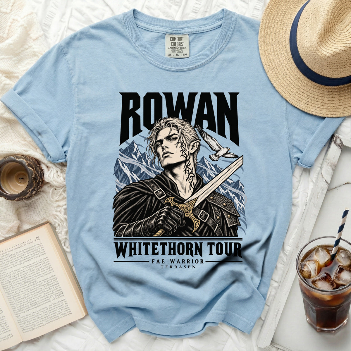 Light blue Comfort Colors t-shirt with "Rowan" and "Whitethorn Tour Fae Warrior Terrasen" graphic.