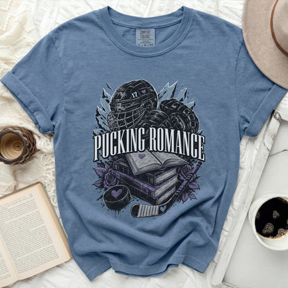 Blue t-shirt with hockey gear, books, and "Pucking Romance" text.
