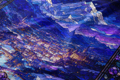 Stained glass pattern with a city and mountain landscape at night.
