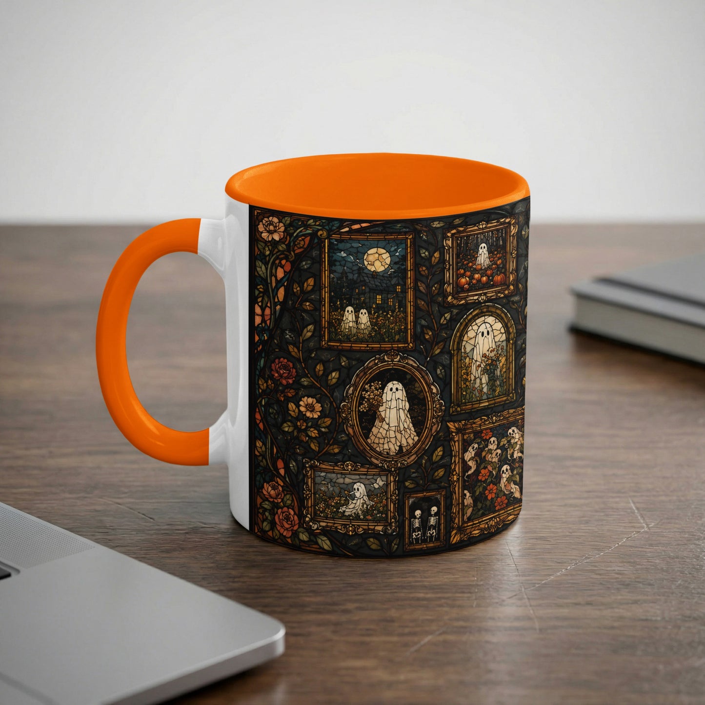 White mug with orange handle featuring a stained glass pattern of ghosts and pumpkins.