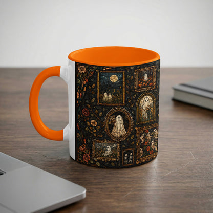 White mug with orange handle featuring a stained glass pattern of ghosts and pumpkins.