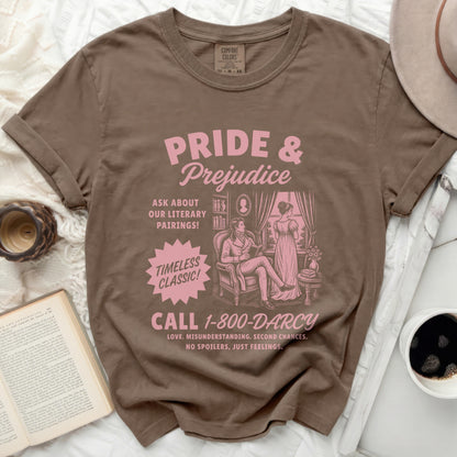 Brown t-shirt with "Pride & Prejudice" literary graphic and phone number.
