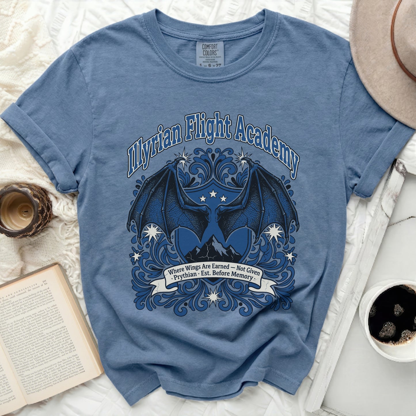 Myrian Flight Academy t-shirt with dragon wings and mountains design.