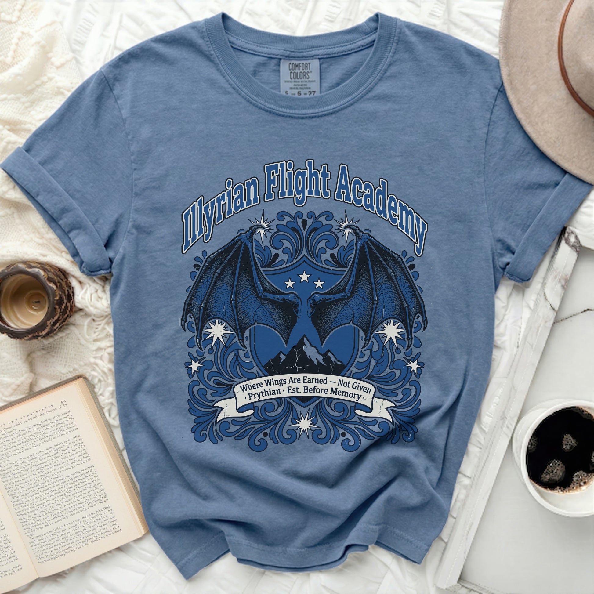 Myrian Flight Academy t-shirt with dragon wings and mountains design.