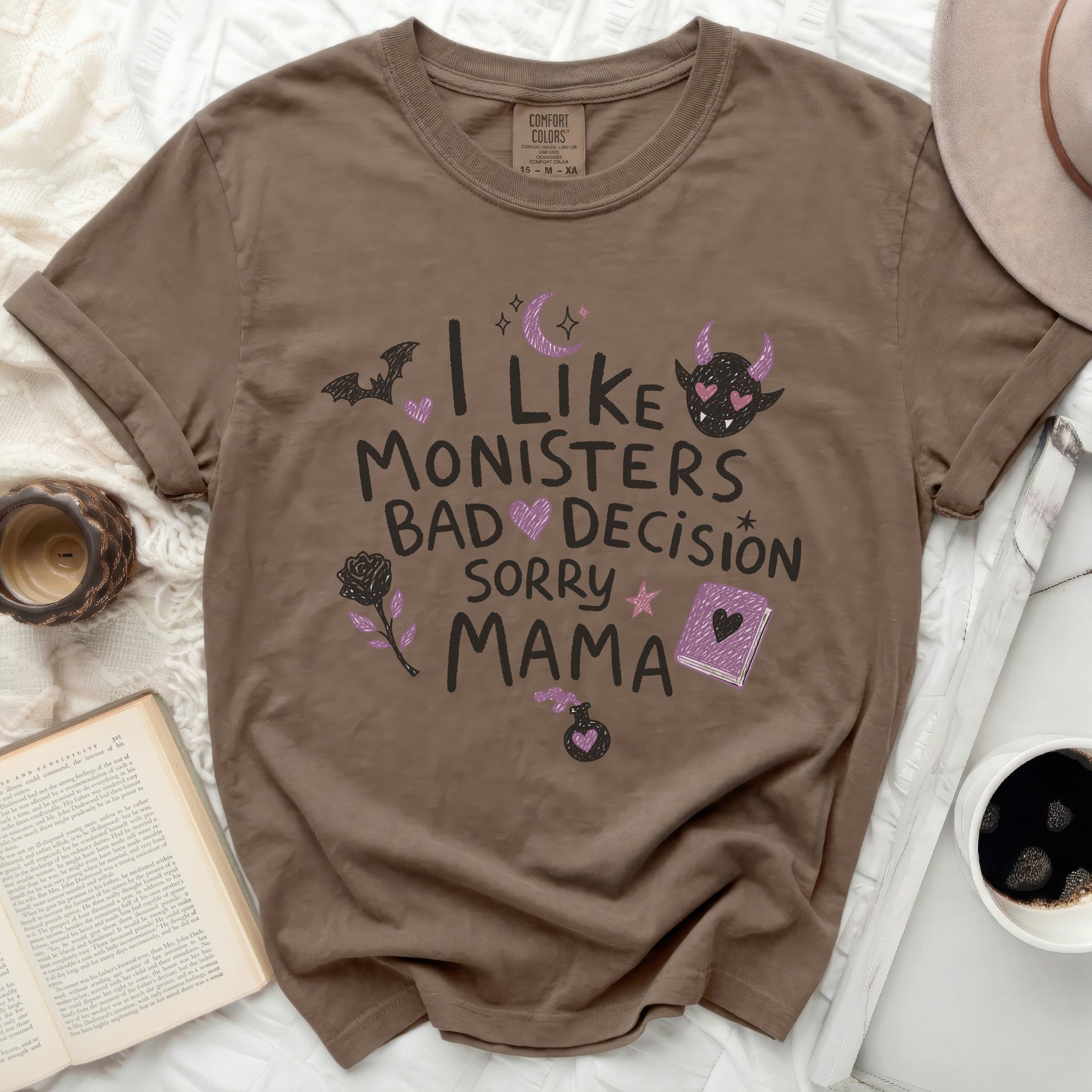 T-shirt with "I like monsters bad decision sorry mama" text and playful graphics.