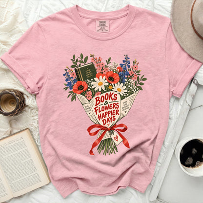 Pink t-shirt with a bouquet of books and flowers that reads "Books & Flowers Happier Days".