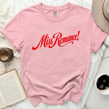 Pink t-shirt with red script text "Miss Romance!" and Comfort Colors tag.