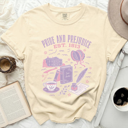 Cream t-shirt with Pride and Prejudice Est. 1813 design and literary motifs.