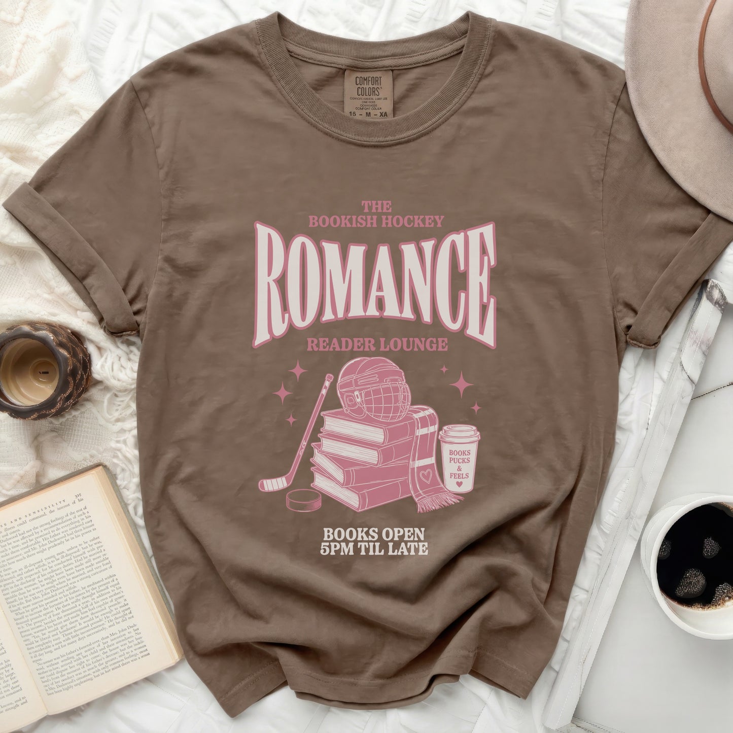 Brown t-shirt with "Bookish Hockey Reader Lounge" text and hockey imagery.