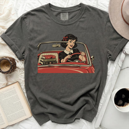 Dark gray t-shirt with a vintage comic graphic of a woman driving a red car.