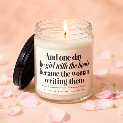 Candle with text "And one day the girl with the books became the woman writing them" and "100% Soy Wax".