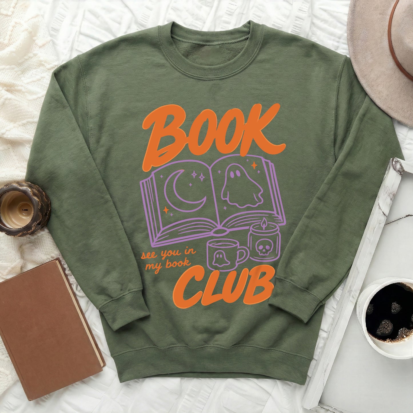 Olive green sweatshirt with "Book Club" graphic featuring ghost and moon.