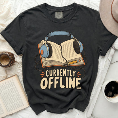 Dark t-shirt with graphic of headphones over open book and text "CURRENTLY OFFLINE".