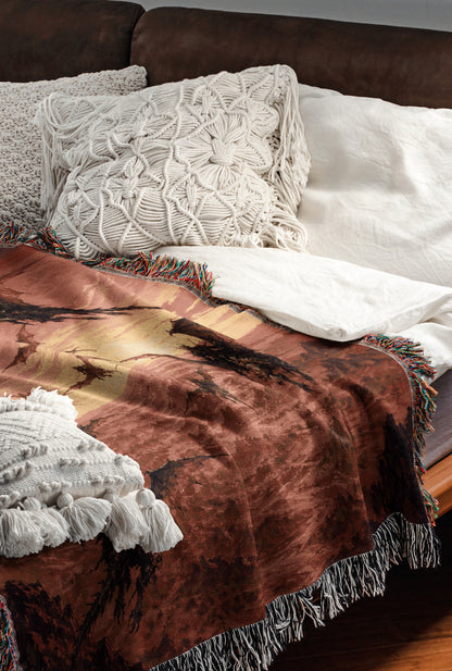 a cozy and inviting bedroom scene, featuring a bed with a brown blanket and white pillows, a wooden headboard, and a brown leather couch.