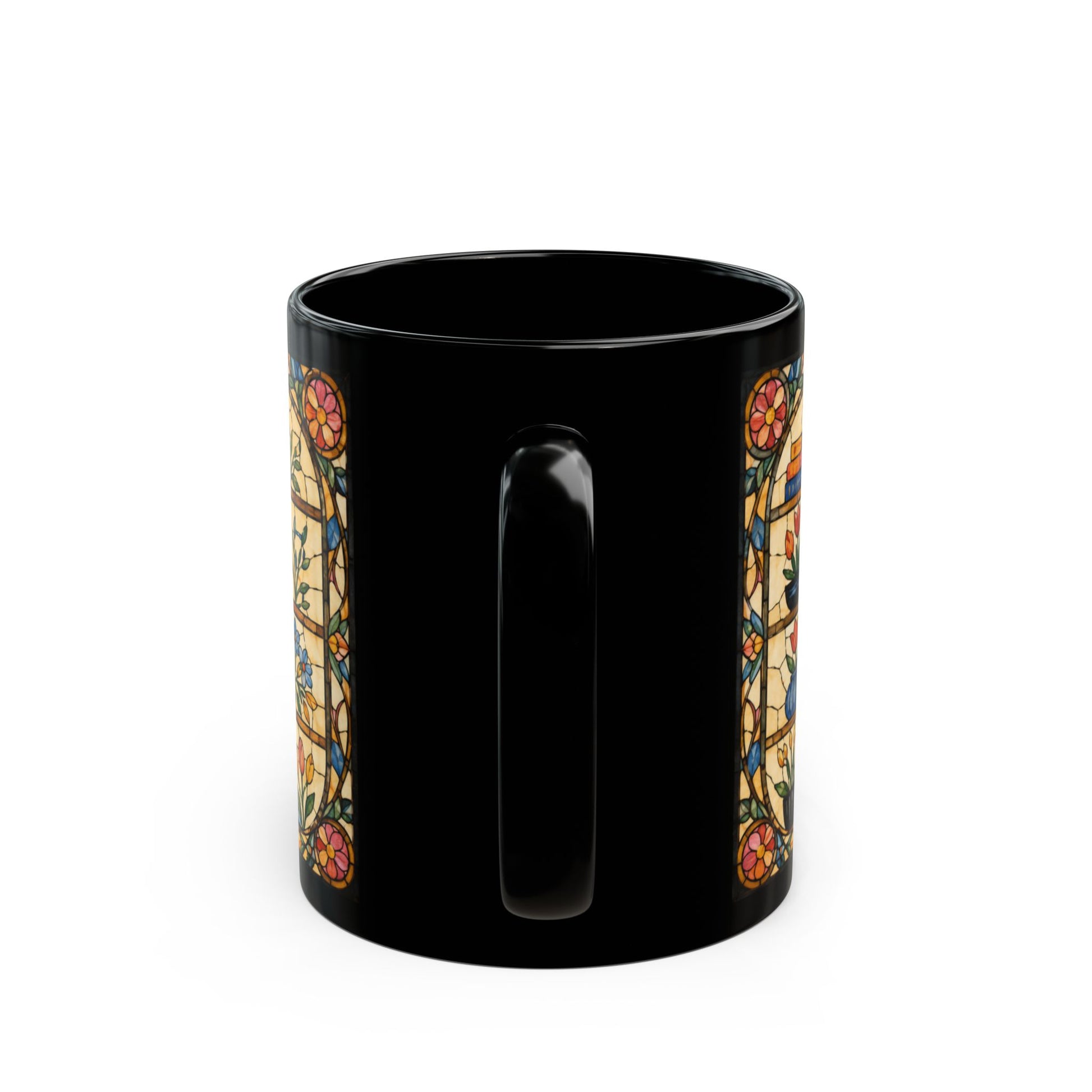 Black mug with stained glass floral border design on both sides.