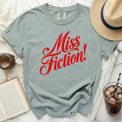 Light green t-shirt with red "Miss Fiction!" text
