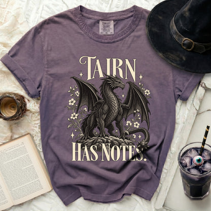 Purple t-shirt with a dragon graphic and text that reads "TAIRN HAS NOTES."