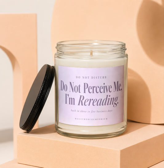 Glass candle with lavender label that reads "Do Not Perceive Me, I'm Rereading."