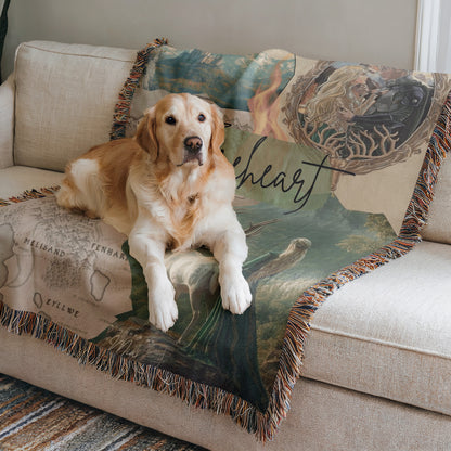 A golden retriever dog is lying on a couch with a colorful, patterned blanket featuring a map and the word "heart".