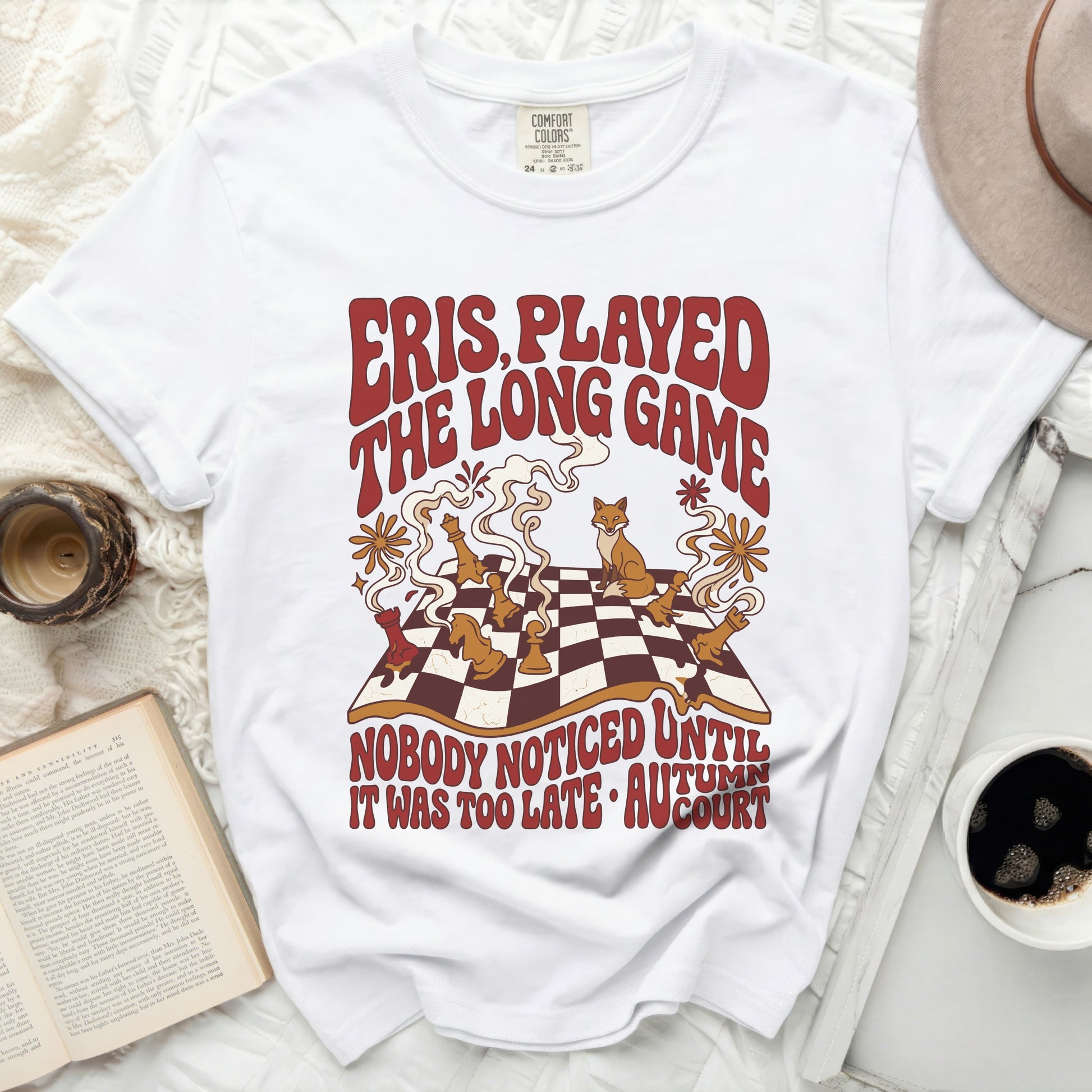 T-shirt with red text "Eris Played The Long Game" and chess pieces.
