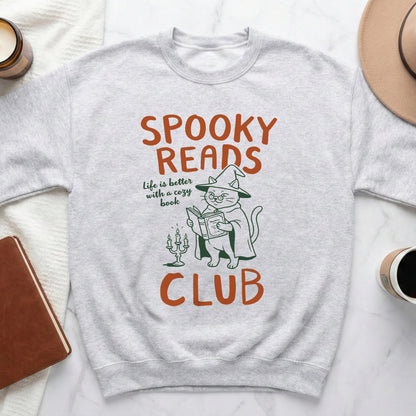 Light gray sweatshirt with "Spooky Reads Club" text and a cat in a witch hat reading.