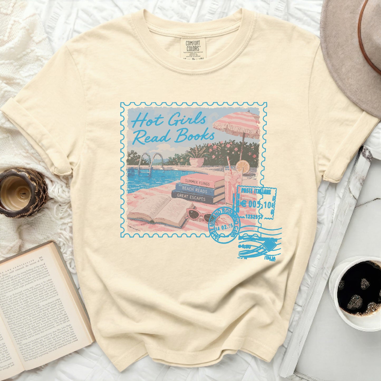 Cream t-shirt with "Hot Girls Read Books" stamp graphic and poolside imagery.