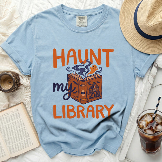Light blue t-shirt with "Haunt My Library" Halloween graphic.