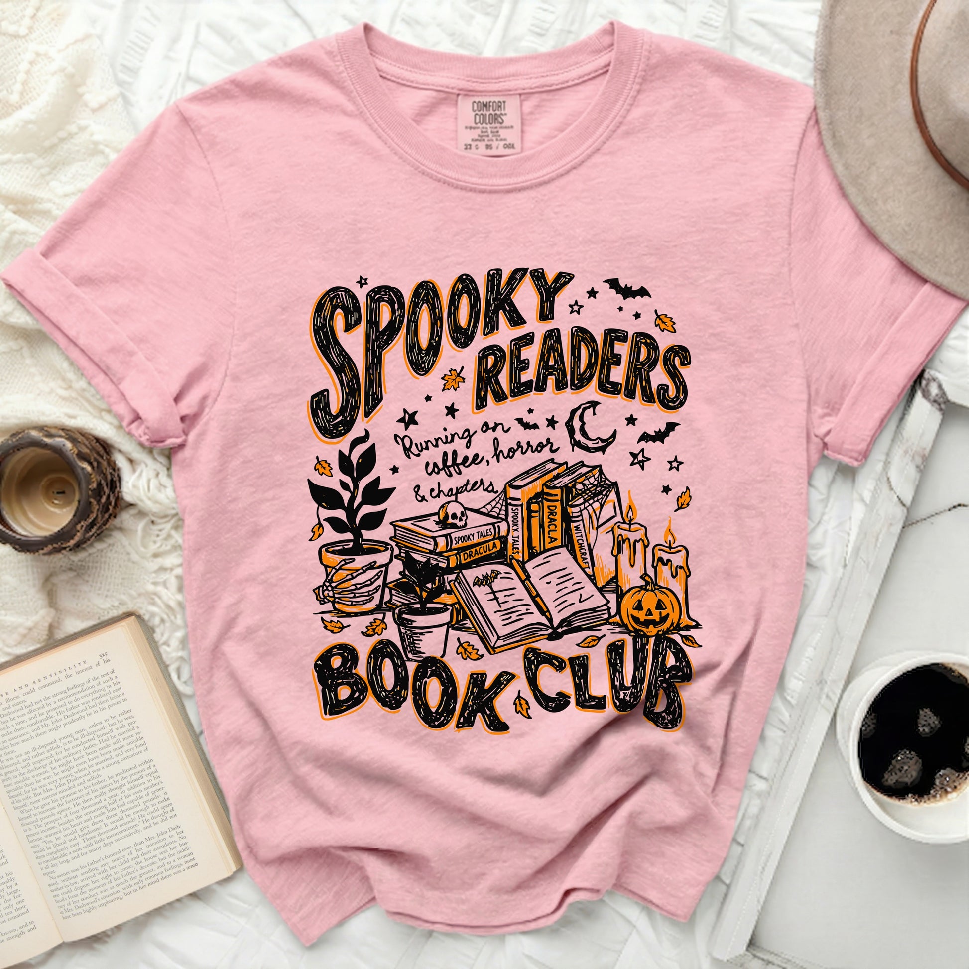 Pink Comfort Colors t-shirt with "Spooky Readers Book Club" and Halloween graphics.