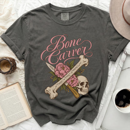 Dark grey t-shirt with pink "Bone Carver" text and skull design.
