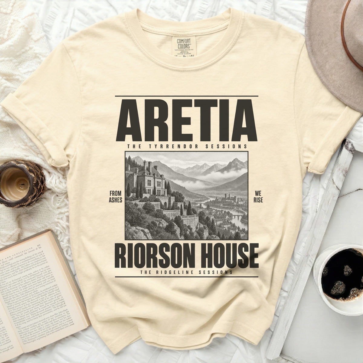 Cream t-shirt with "ARETIA THE TYRRENDOR SESSIONS RIORSON HOUSE THE RIDGELINE SESSIONS" text and a castle illustration.