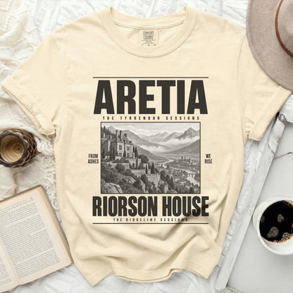 Cream t-shirt with "ARETIA THE TYRRENDOR SESSIONS RIORSON HOUSE THE RIDGELINE SESSIONS" text and a castle illustration.