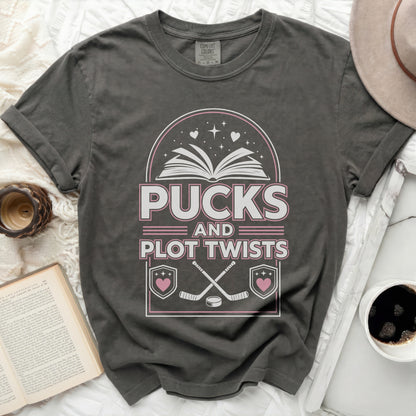 T-shirt with "Pucks and Plot Twists" text and hockey graphics.