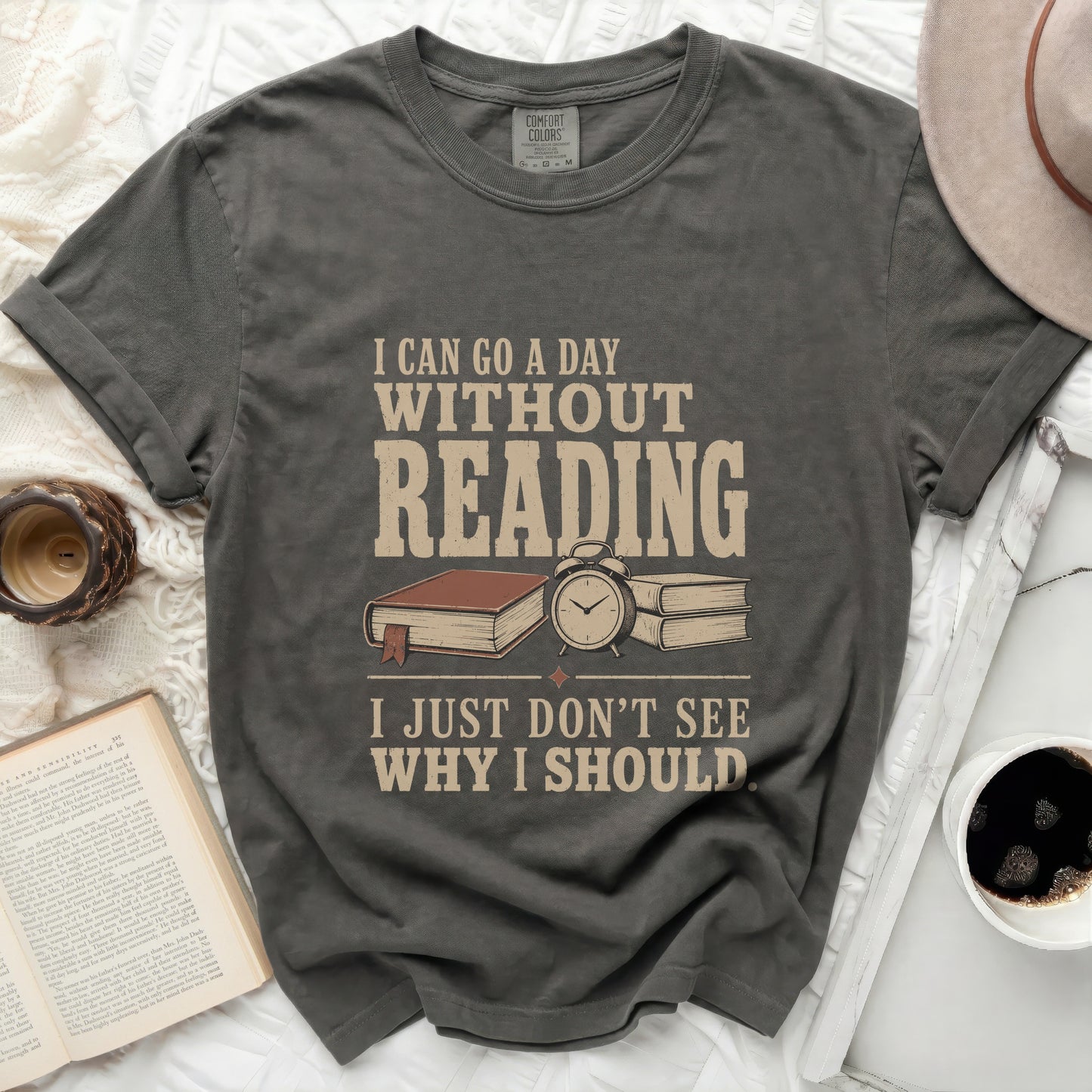 Graphic tee with the text "I CAN GO A DAY WITHOUT READING I JUST DON'T SEE WHY I SHOULD".