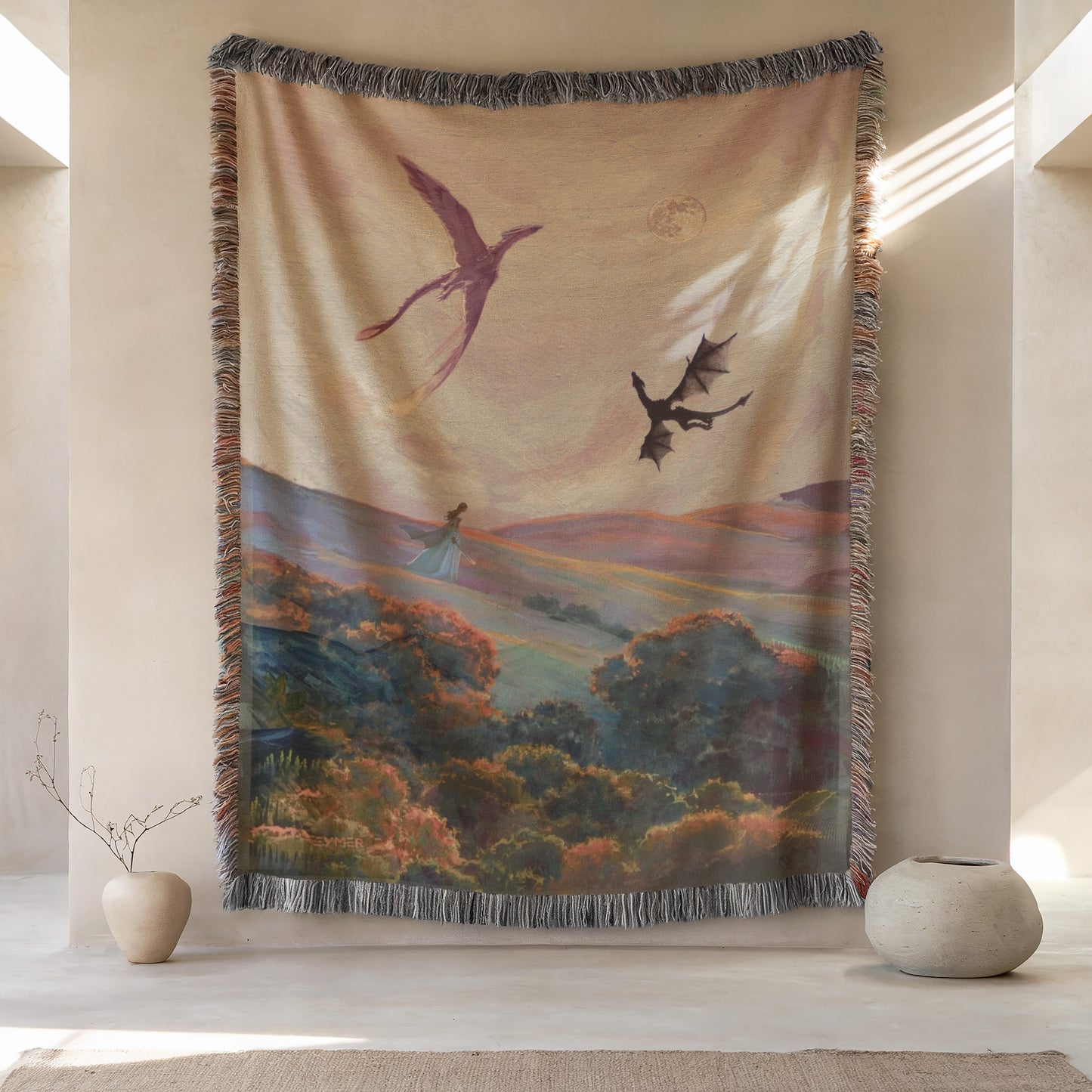 a large tapestry hanging on a wall, depicting a landscape with a dragon flying over a field of flowers. The tapestry is framed by a fringe border and is placed between two small vases, one on each side.