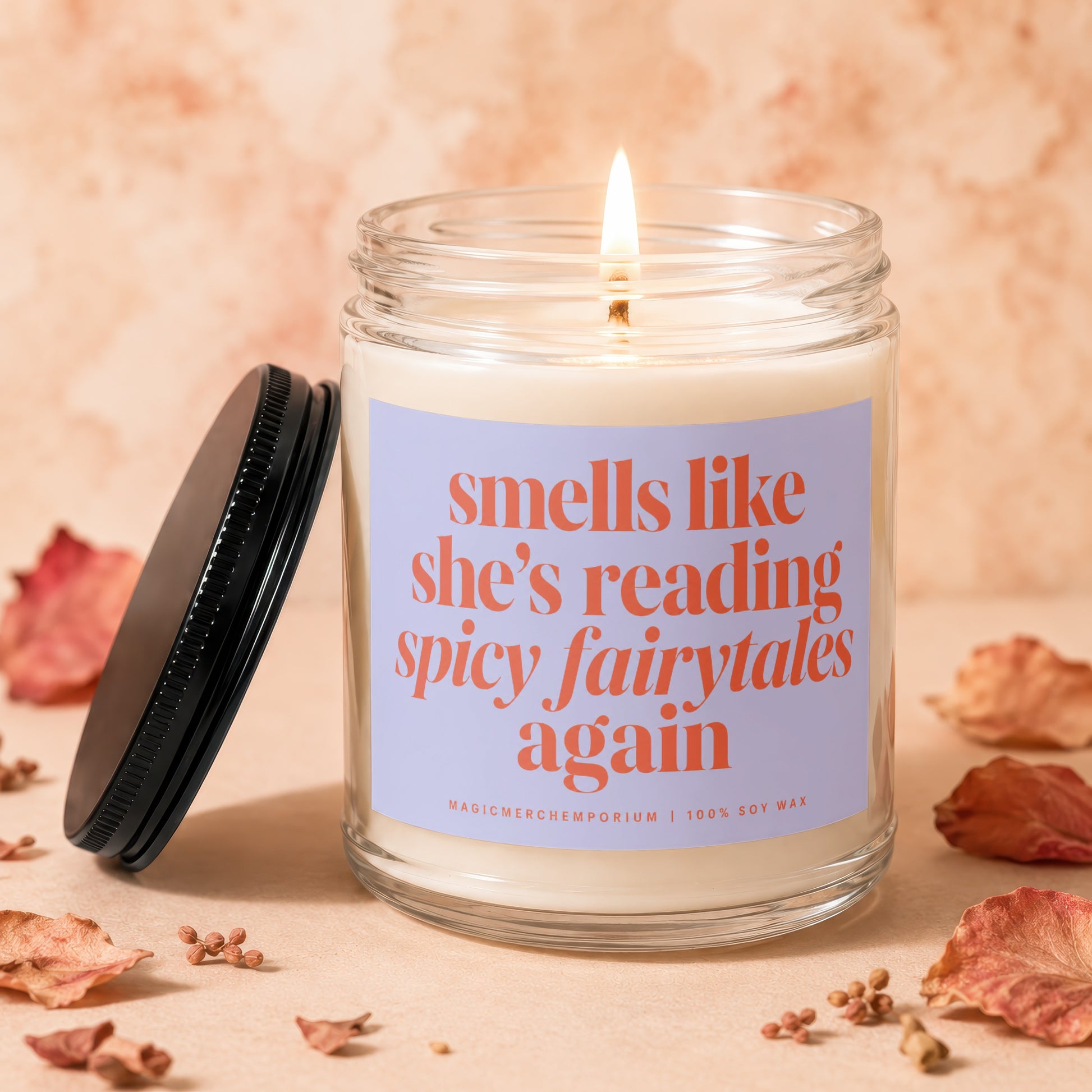 Candle with text "smells like she's reading spicy fairytales again".