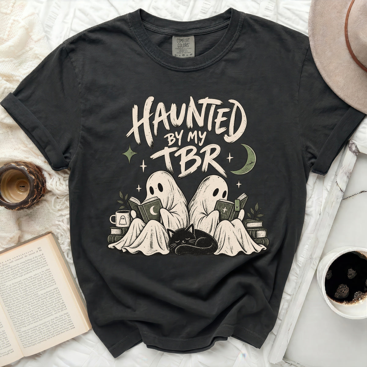 Dark gray t-shirt with "HAUNTED BY MY TBR" text and ghost reading.