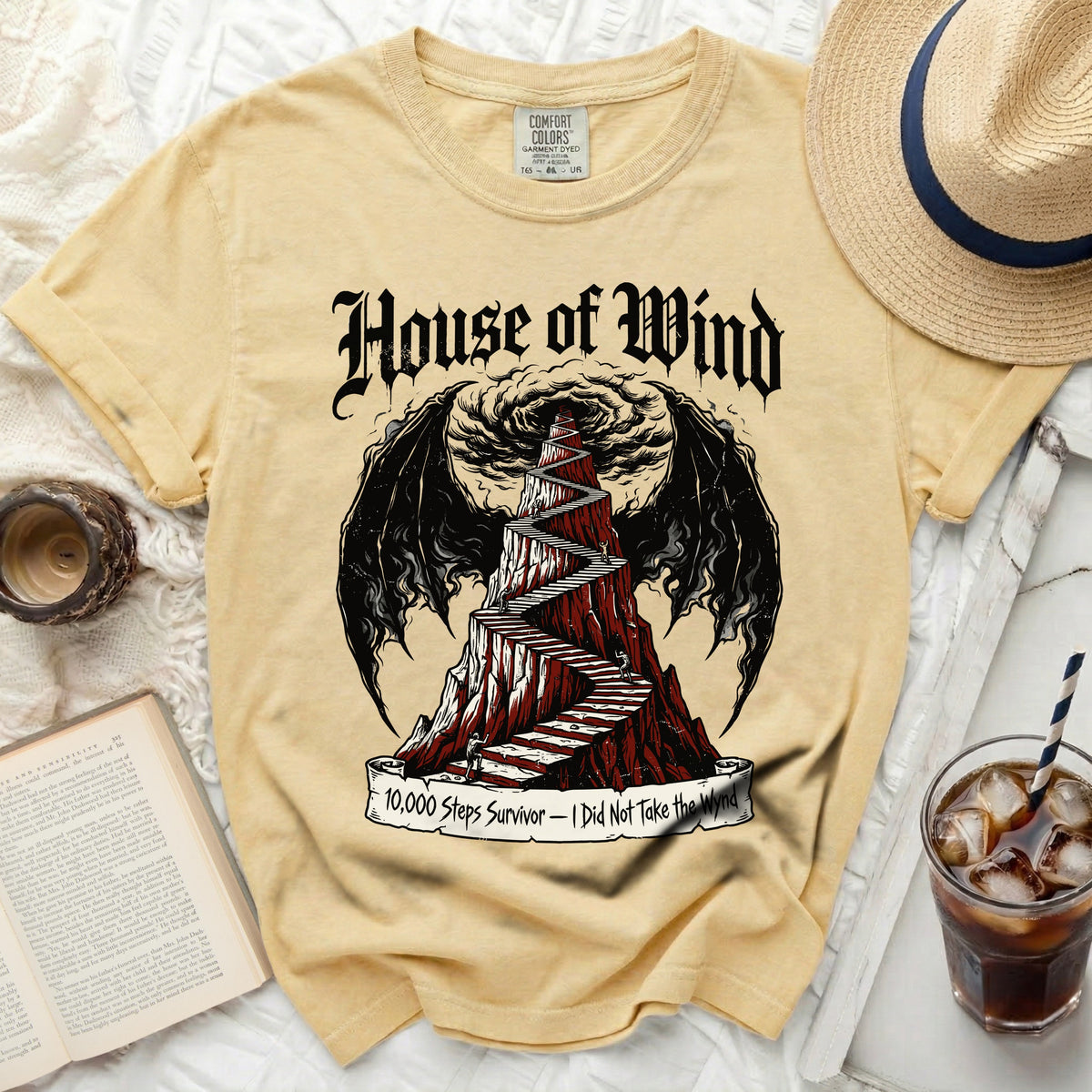 Yellow Comfort Colors t-shirt with "House of Wind" and a winding staircase design.