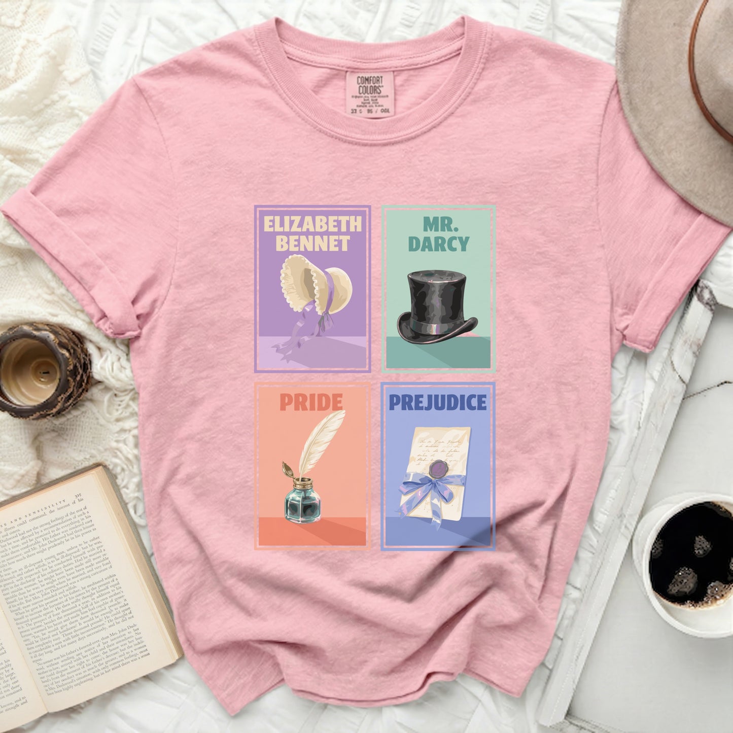 Pink t-shirt with Pride and Prejudice featuring Elizabeth Bennet, Mr. Darcy, and literary symbols.