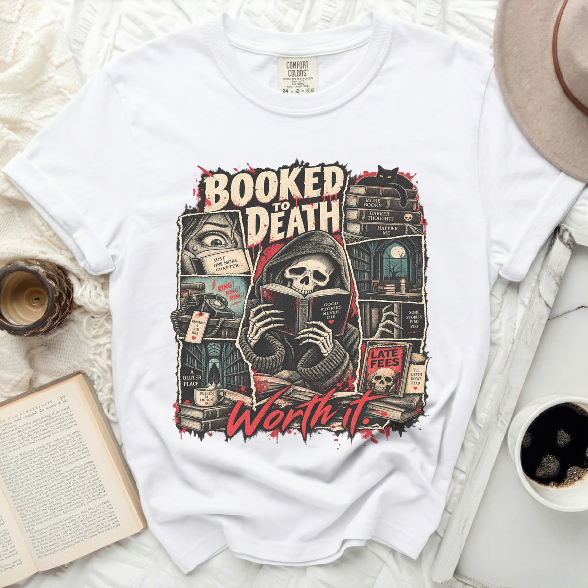 White t-shirt with "Booked to Death" graphic featuring a skeleton reading and books.