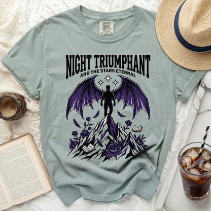 Night Triumphant and the Stars Eternal graphic on a light green t-shirt.