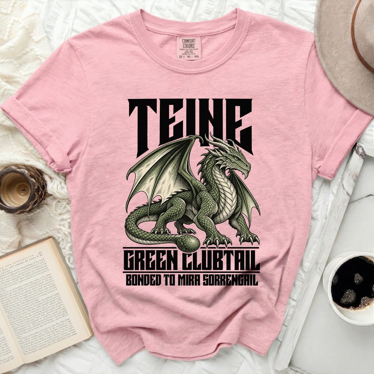 Pink t-shirt with green dragon graphic and text "TEINE", "GREEN CLUBTAIL", "BONDED TO MIRA SORRENGAIL".