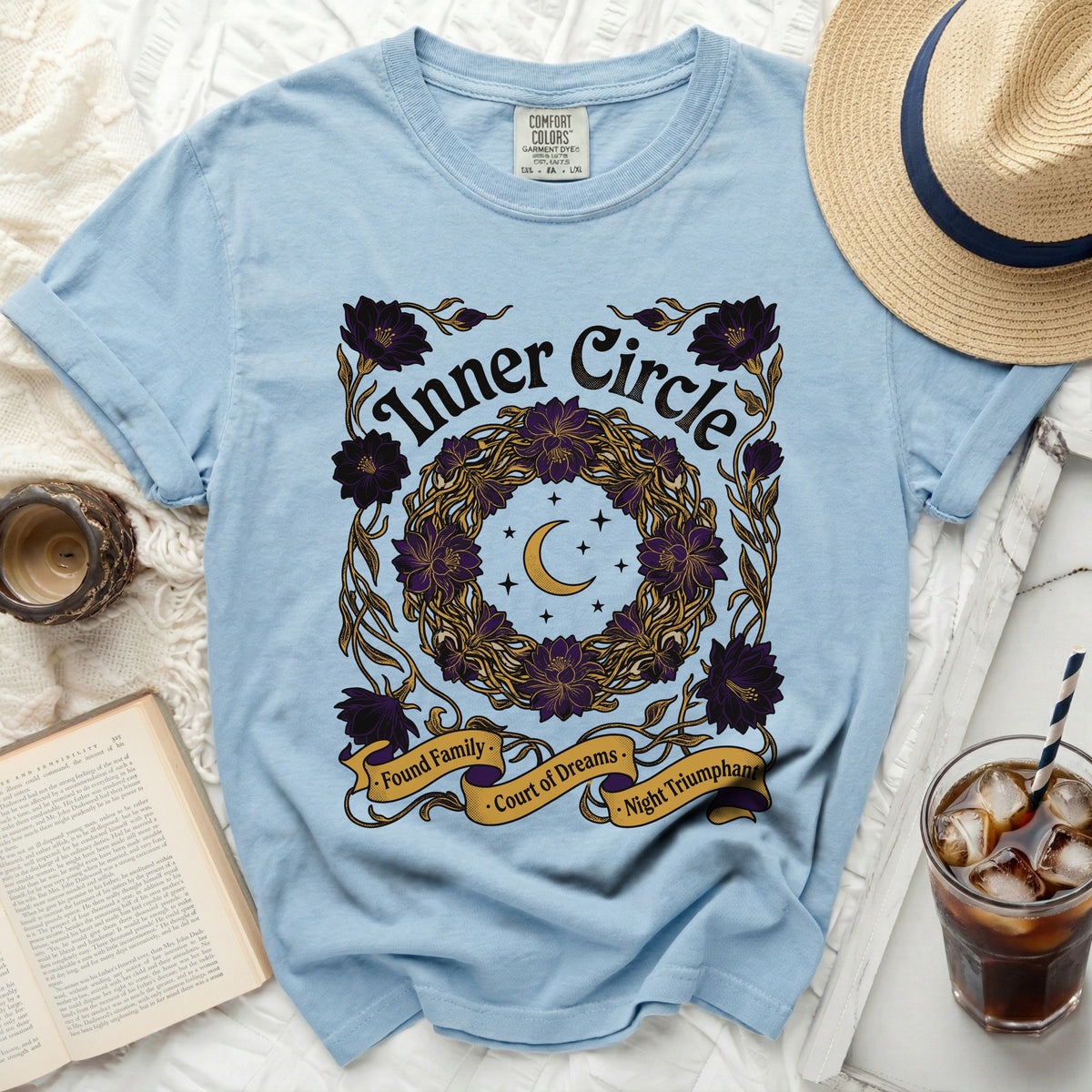 Light blue t-shirt with "Inner Circle" text and floral wreath graphic.