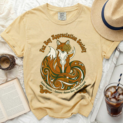 Yellow t-shirt with a brown fox graphic and "Fox Boy Appreciation Society" text.