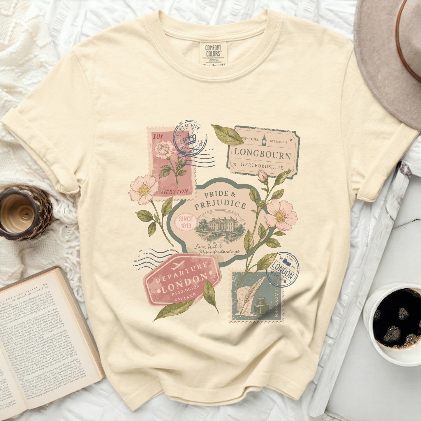 Cream t-shirt with vintage postage stamps and floral design.