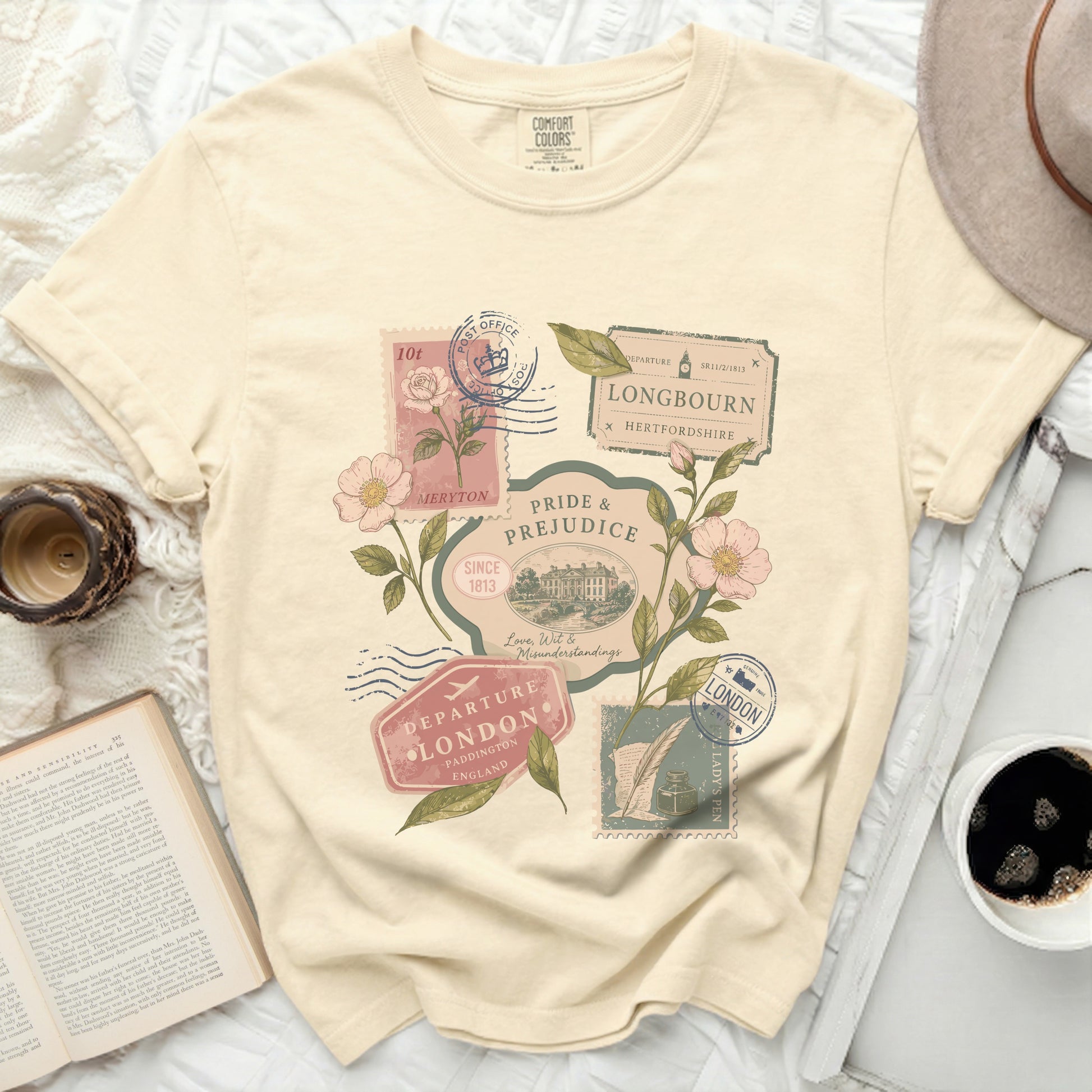 Cream t-shirt with vintage postage stamps and floral design.