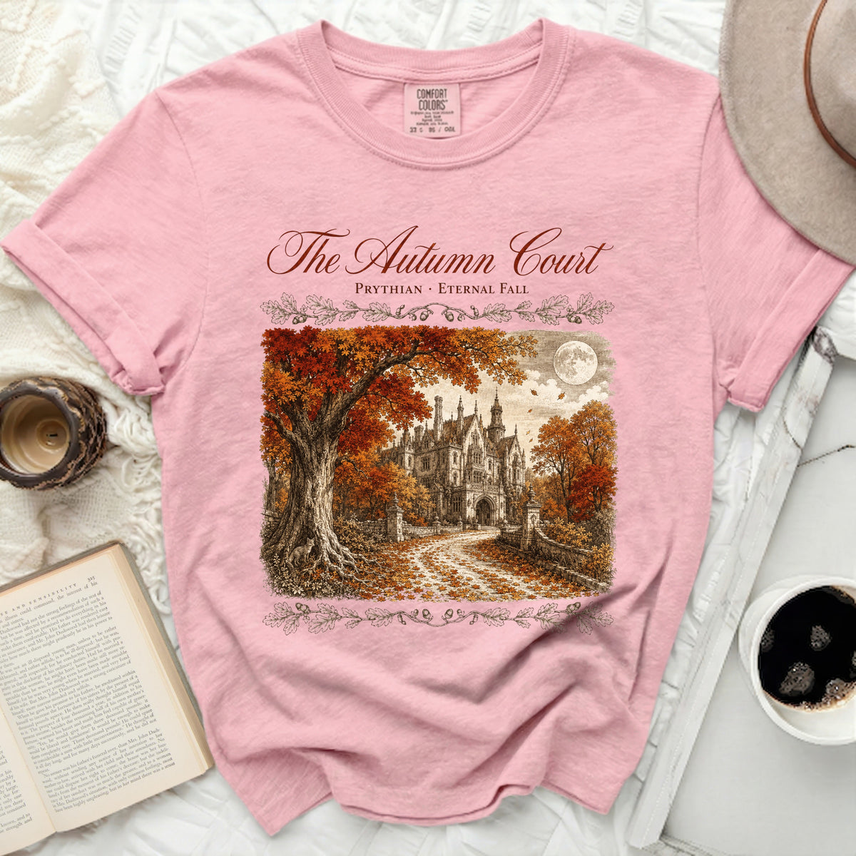 Pink t-shirt with "The Autumn Court" and a castle scene.